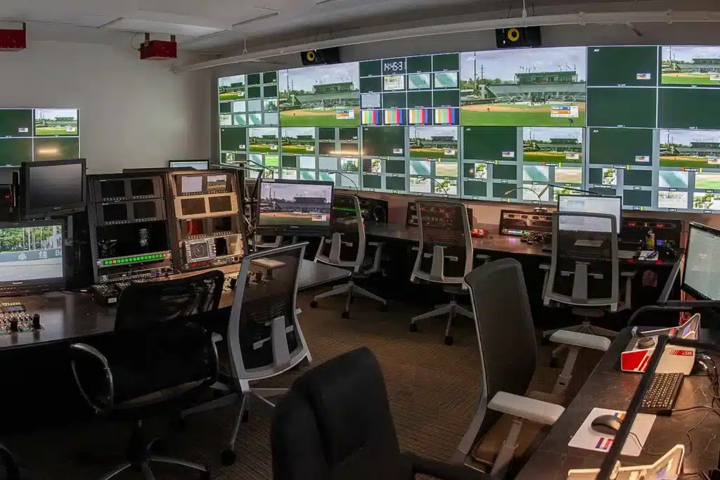 Television broadcast control room with production monitors and video displays