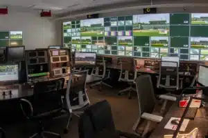 Television broadcast control room with production monitors and video displays