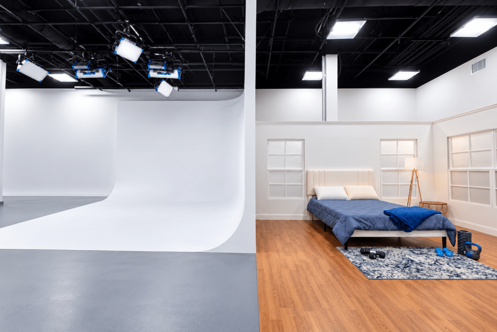 TV studio with cyclorama, bedroom set and production lighting